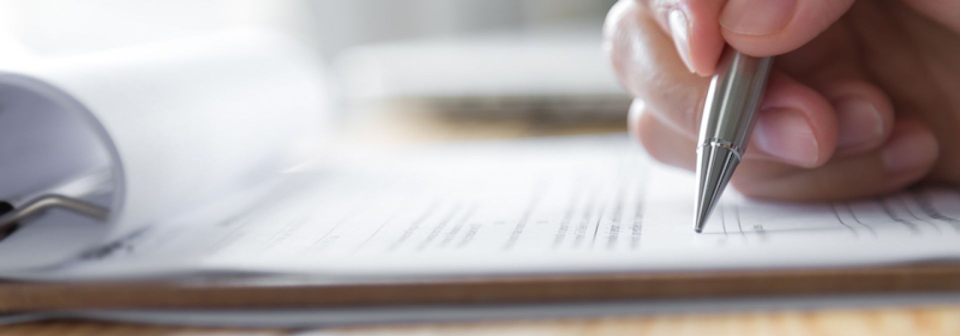 Person filing out a paper form